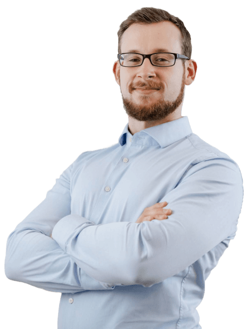Martin Welschinger mit Brille und verschränkten Armen im hellblauen Hemd